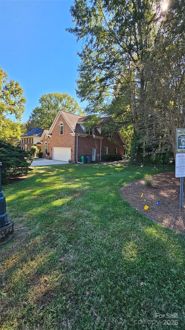 view of yard featuring a garage