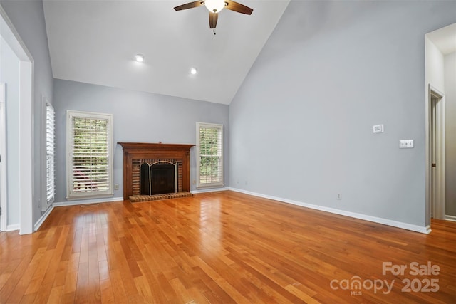 8731 Sheltonham Way, Charlotte, NC 28216 - unfurnished living room with high vaulted ceiling, healthy amount of natural light, ceiling fan, light wood-style flooring, and a brick fireplace