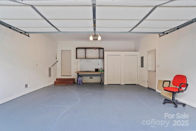 8731 Sheltonham Way, Charlotte, NC 28216 - garage featuring a garage door opener and electric panel