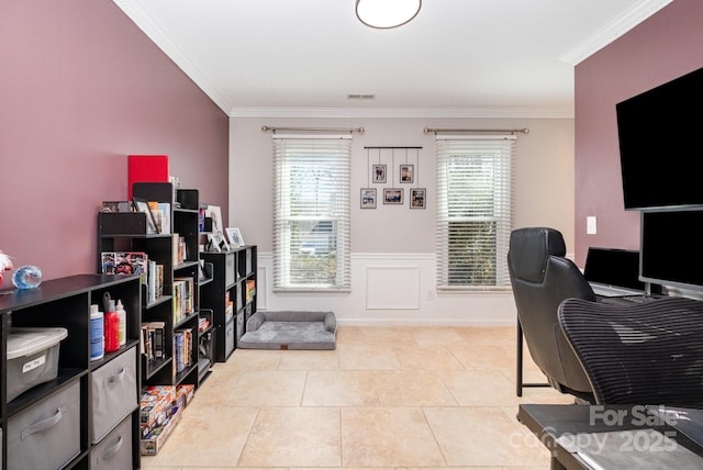 office space featuring light tile patterned floors, visible vents, crown molding, and a wainscoted wall