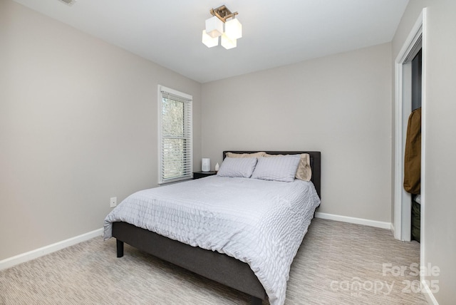 carpeted bedroom with baseboards