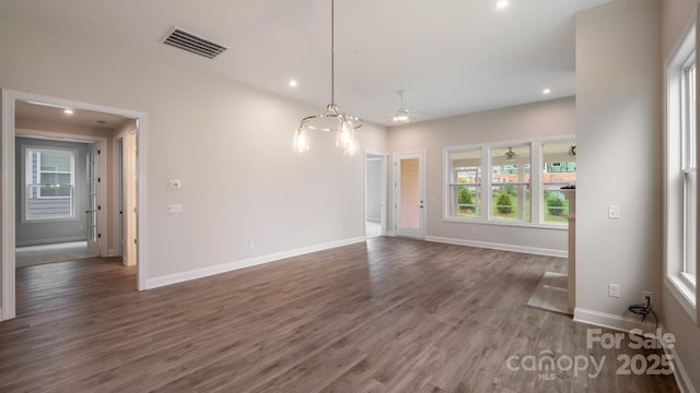 spare room featuring baseboards, visible vents, wood finished floors, and recessed lighting