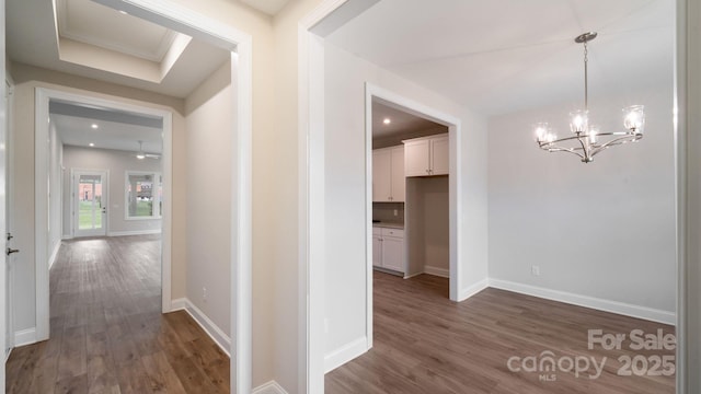 hall with an inviting chandelier, baseboards, dark wood finished floors, and recessed lighting