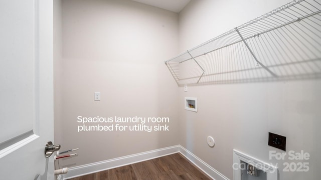 laundry room featuring laundry area, dark wood-type flooring, hookup for a washing machine, and baseboards