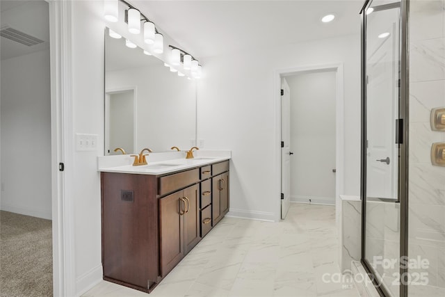 bathroom featuring a sink, visible vents, marble finish floor, a shower stall, and double vanity