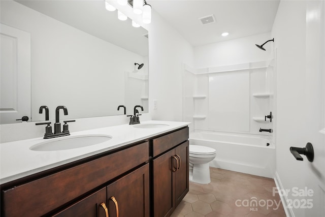 full bath featuring double vanity, tile patterned flooring, visible vents, and a sink