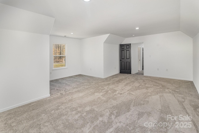 bonus room with vaulted ceiling, recessed lighting, carpet flooring, and baseboards