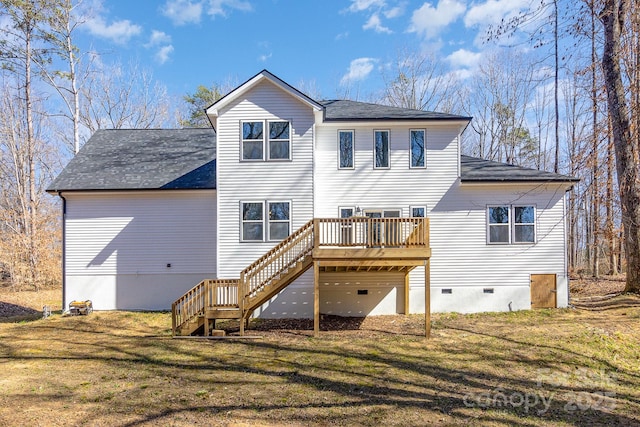 rear view of property with a deck, a yard, stairway, and crawl space