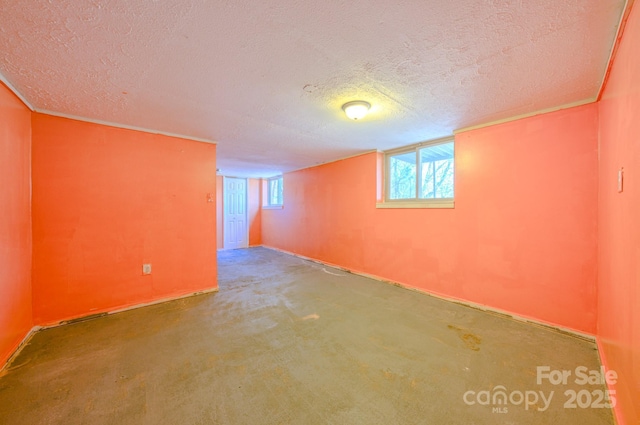 basement featuring a textured ceiling