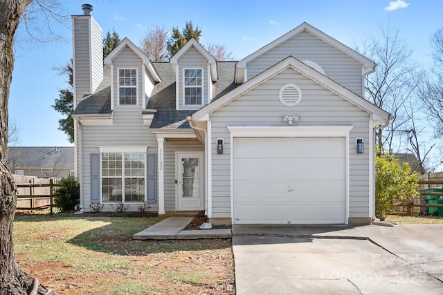 view of front of home featuring driveway, a shingled roof, a chimney, an attached garage, and fence