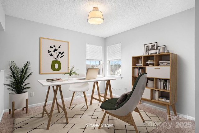 office area featuring a textured ceiling and baseboards