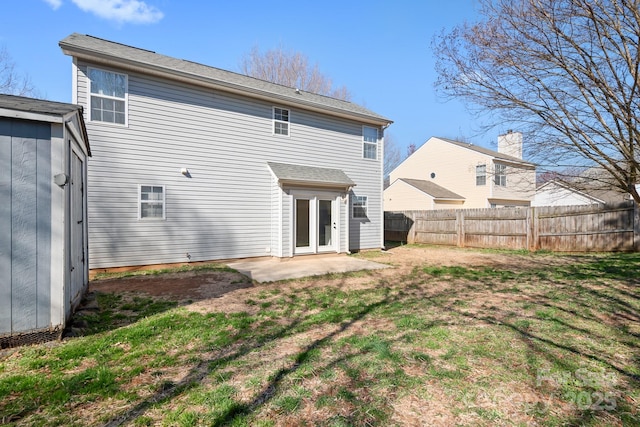 back of property featuring a patio, a lawn, and fence