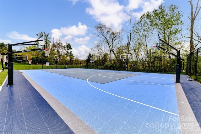 view of basketball court with community basketball court and fence