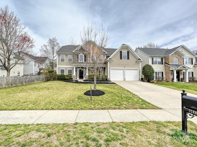 view of front of house with a garage, a front yard, driveway, and fence