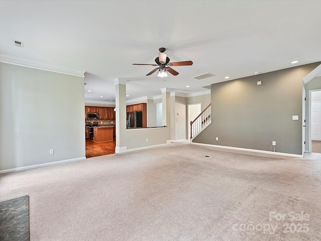 unfurnished living room featuring recessed lighting, baseboards, a ceiling fan, and crown molding