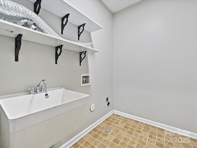 laundry room featuring electric dryer hookup, washer hookup, a sink, baseboards, and laundry area