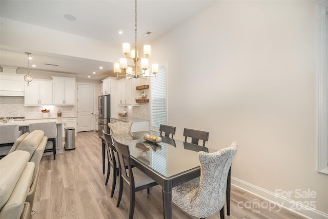 dining space with a chandelier, light wood finished floors, recessed lighting, and baseboards