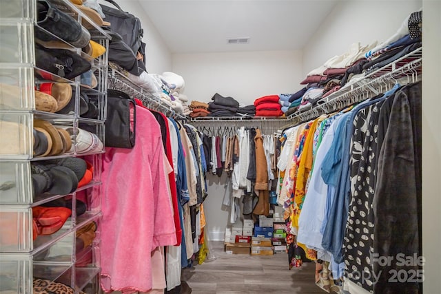 spacious closet with wood finished floors and visible vents