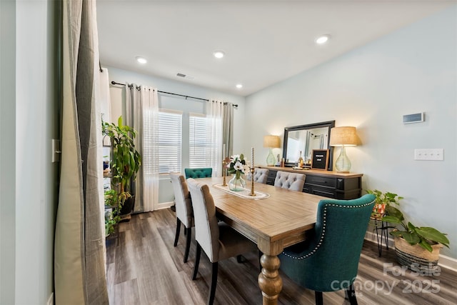 dining area featuring baseboards, visible vents, wood finished floors, and recessed lighting