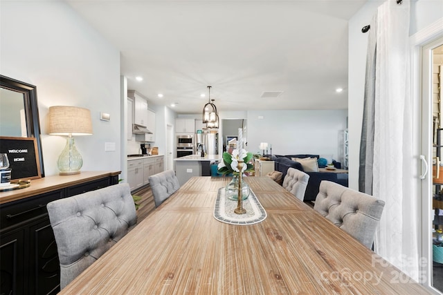 dining room with visible vents and recessed lighting