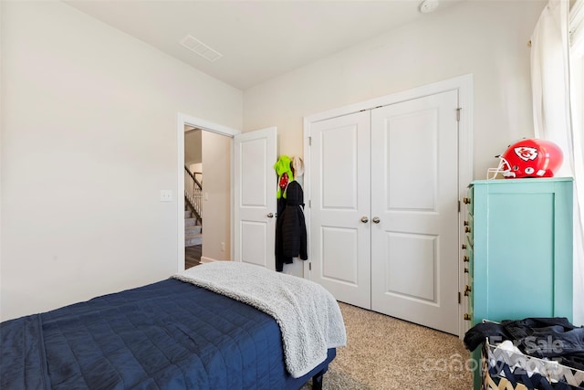 bedroom featuring visible vents and a closet