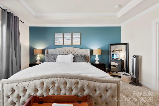 carpeted bedroom with ornamental molding, a raised ceiling, and baseboards