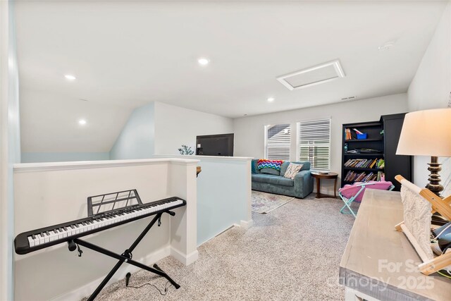 interior space featuring attic access, recessed lighting, and carpet floors