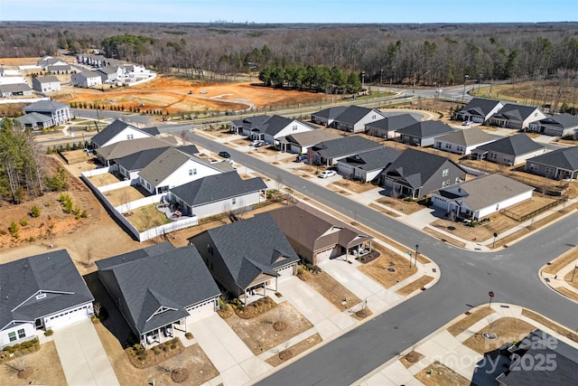 bird's eye view with a residential view and a view of trees