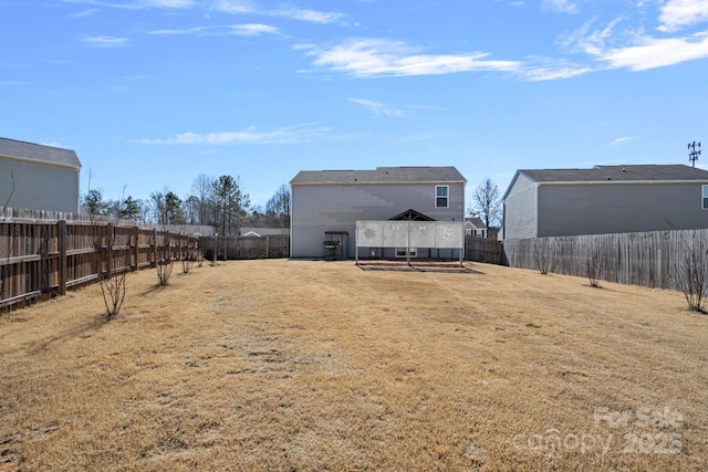 view of yard with a fenced backyard