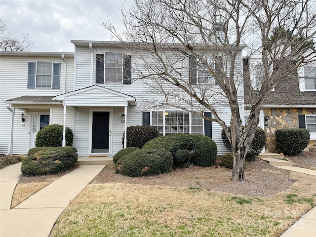 view of property featuring a front yard