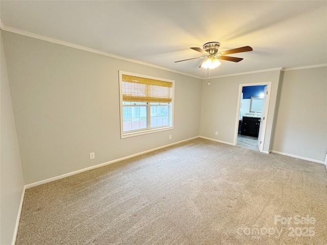 empty room with light colored carpet, crown molding, baseboards, and ceiling fan