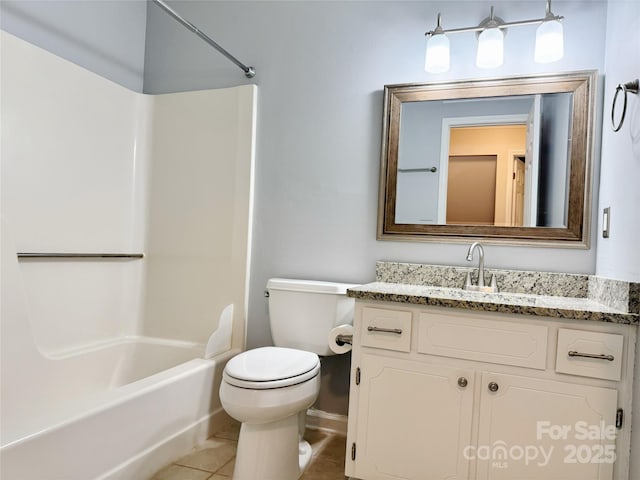 bathroom featuring tile patterned flooring, shower / bath combination, vanity, and toilet