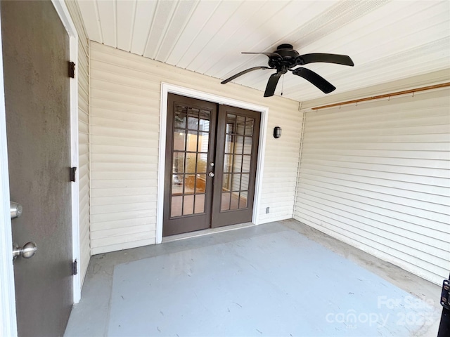 property entrance featuring ceiling fan and french doors