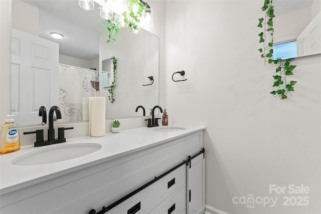 bathroom with double vanity and a sink