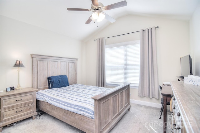 bedroom with light colored carpet, baseboards, a ceiling fan, and vaulted ceiling