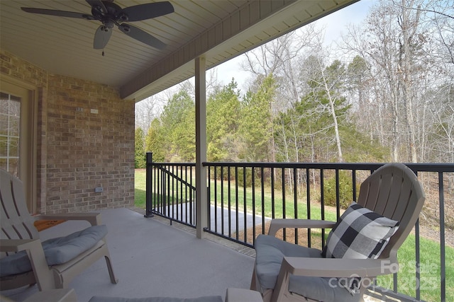 exterior space featuring ceiling fan