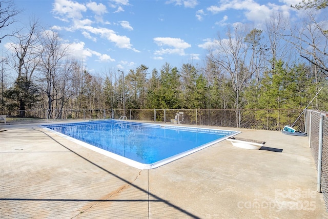 view of pool with a patio area, fence, and a fenced in pool