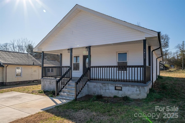 bungalow-style house featuring covered porch and crawl space