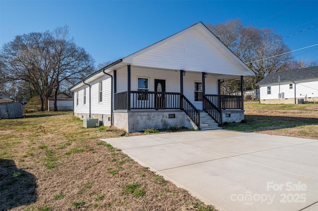 view of front of property featuring crawl space, covered porch, a front lawn, and central air condition unit