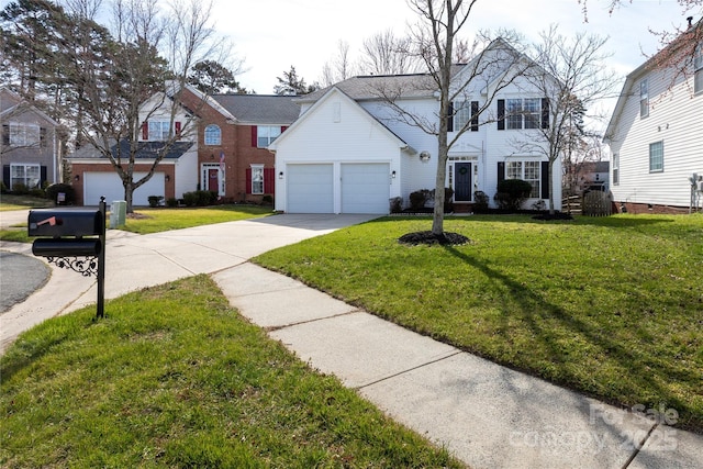 view of front of house with a garage, driveway, and a front yard