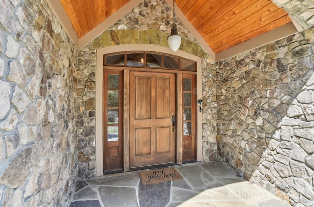 property entrance with stone siding