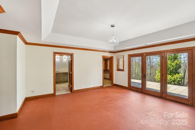 unfurnished room with an inviting chandelier, a raised ceiling, french doors, baseboards, and carpet flooring