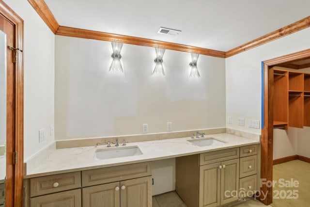 bathroom with ornamental molding, a sink, visible vents, and double vanity
