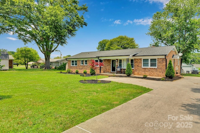 905 Blalock Dr, Kings Mountain, NC 28086 - ranch-style house featuring a porch, brick siding, a front lawn, roof with shingles, and a chimney