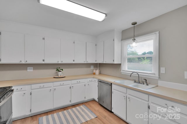 905 Blalock Dr, Kings Mountain, NC 28086 - kitchen with appliances with stainless steel finishes, light wood finished floors, white cabinetry, and light countertops
