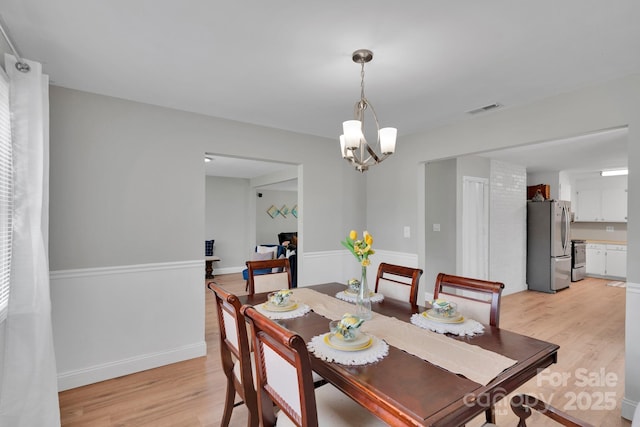 905 Blalock Dr, Kings Mountain, NC 28086 - dining space featuring light wood-type flooring and a chandelier