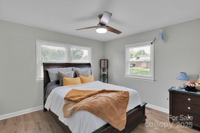 905 Blalock Dr, Kings Mountain, NC 28086 - bedroom with wood finished floors, multiple windows, and ceiling fan
