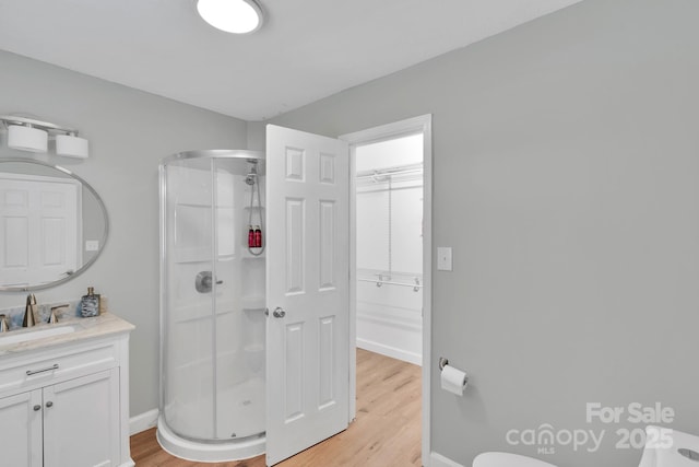 905 Blalock Dr, Kings Mountain, NC 28086 - full bathroom featuring a stall shower, vanity, and wood finished floors
