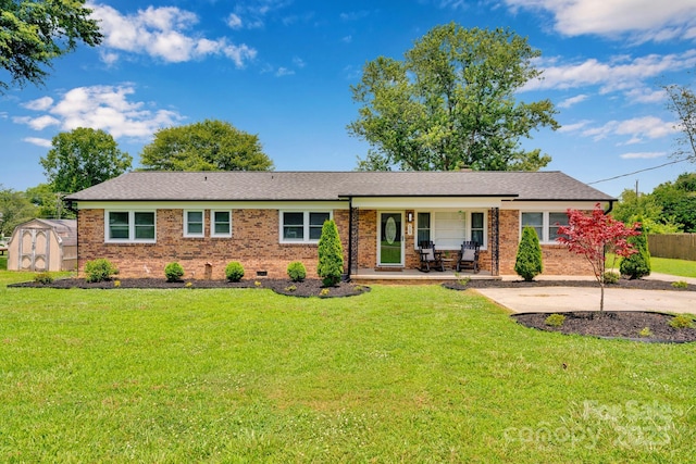 905 Blalock Dr, Kings Mountain, NC 28086 - ranch-style house featuring a storage shed, brick siding, covered porch, and a shingled roof