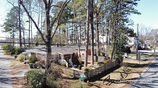 exterior space featuring a residential view and fence